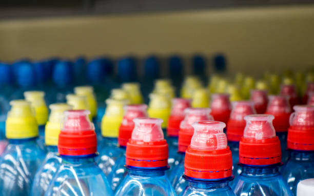 istock Lid plastic water bottle in the market. multi-colored plastic bottle caps 1144134382
