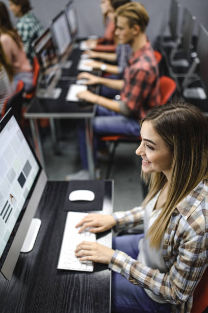 istock Above view of a happy female student e-learning on desktop PC. 1144134440
