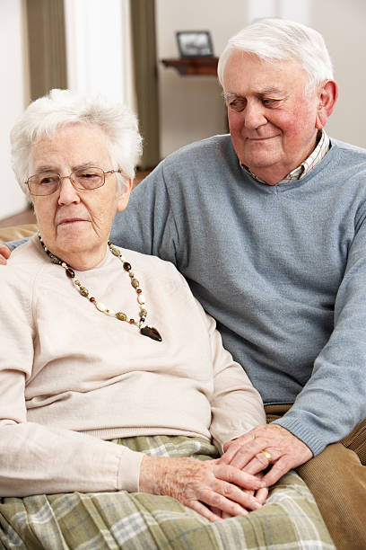 istock Senior Man Consoling Wife At Home 114413452