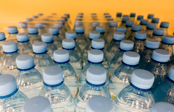 istock Lid plastic water bottle in the market. multi-colored plastic bottle caps 1144134527