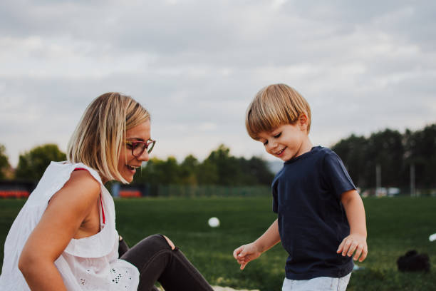 istock Little boy in the sandbox with mom 1144134879