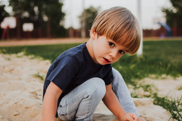 istock Little boy in the sandbox 1144135788