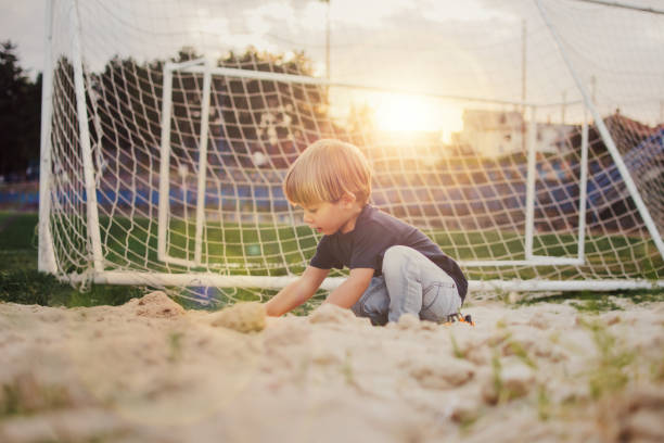 istock Little boy in the sandbox 1144135963