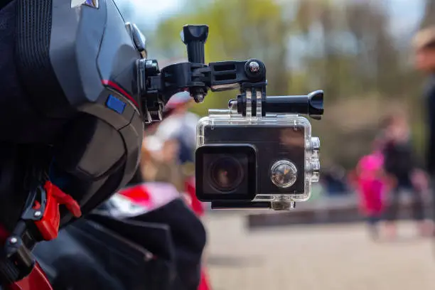 Action camera on a motorcycle rider's helmet.