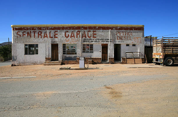 Retro-style photo of an old gas station pumps.