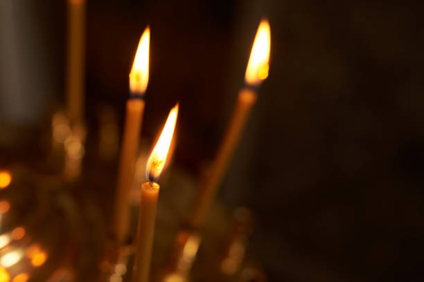 istock Burning wax candle in the Church. 1144139038