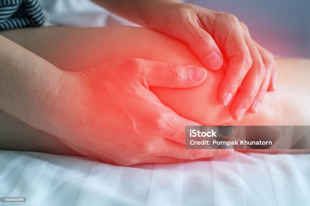 Knee pain disease concept. Hands on leg as hurt from Arthritis, gout or infections. Inflammation Stock Photo