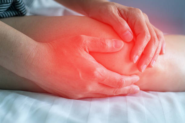 Knee pain disease concept. Hands on leg as hurt from Arthritis, gout or infections. Knee pain disease concept. Hands on leg as hurt from Arthritis, gout or infections. inflammation photos stock pictures, royalty-free photos & images