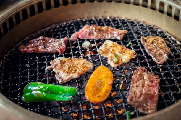 istock Process of cooking  barbecue raw beef on grill in restaurant 1144143986