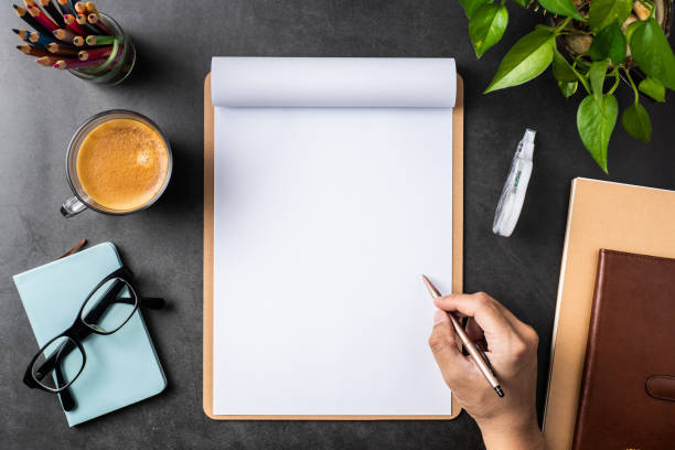 istock white paper with clipboard on black background 1144144137