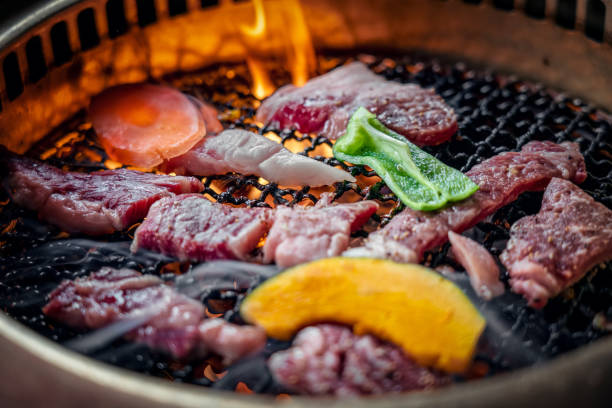 istock Process of cooking  barbecue raw beef on grill in restaurant 1144144180
