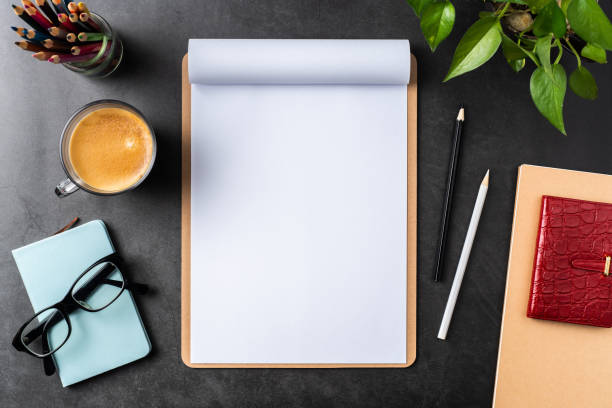istock white paper with clipboard on black background 1144144916