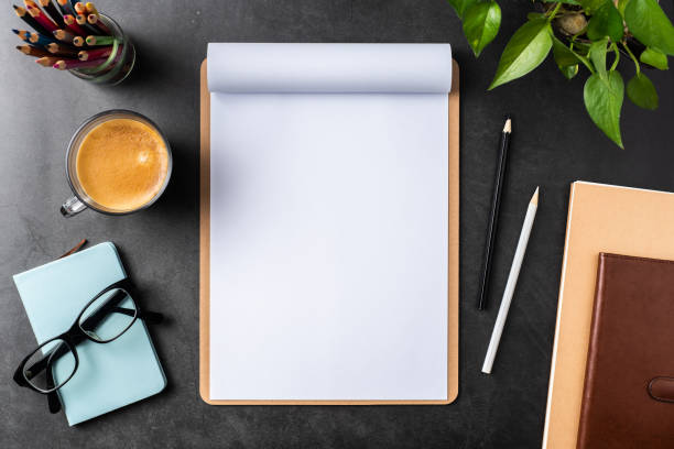 istock white paper with clipboard on black background 1144144933