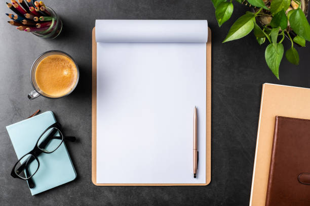 istock white paper with clipboard on black background 1144144953