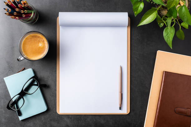 istock white paper with clipboard on black background 1144144964