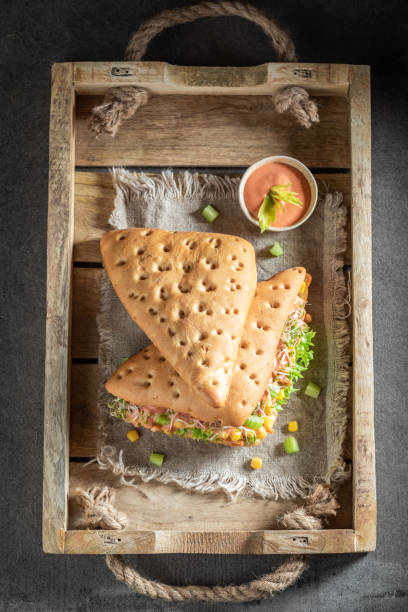 istock Delicious sandwich with lettuce, pepper, corn, and ham 1144145558