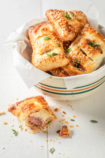 istock Fresh sausage in puff pastry with thyme and sesame seeds 1144146453