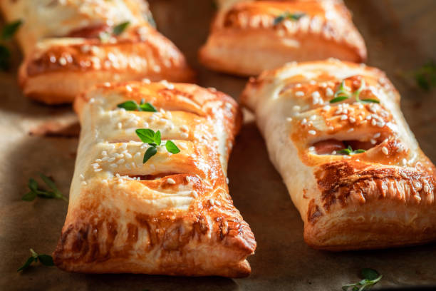 istock Tasty sausage in puff pastry as a snack for breakfast 1144146591