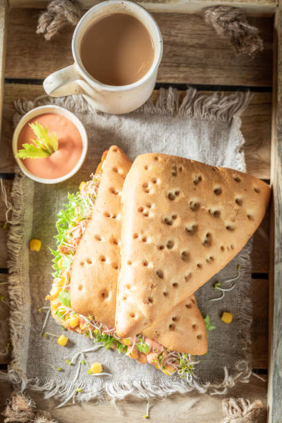 istock Homemade sandwich with lettuce, pepper, corn, and ham 1144146649