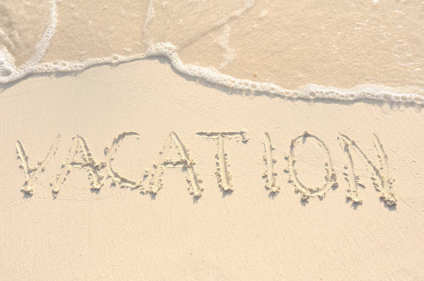 istock Vacation Written in Sand on Beach 114414864
