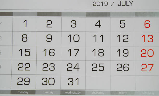 istock Calendar July 2019 with working days and weekends, close-up top view 1144148884