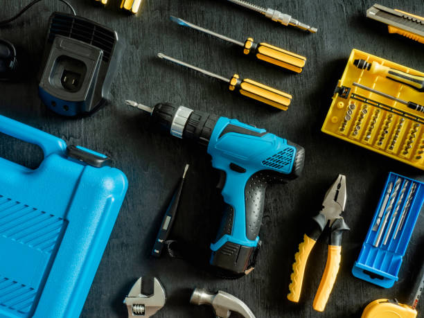 istock top view of Construction tools concept with Drill sets, hammer, screwdriver and Toolbox on black wooden background. 1144153202