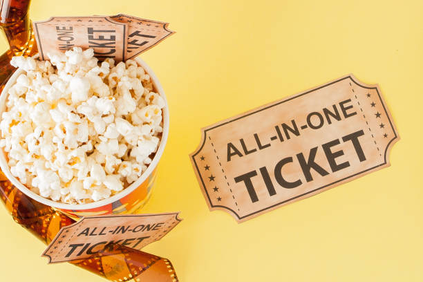 istock Movie tickets, film strips and popcorn on blue background. Copy space for text 1144153230