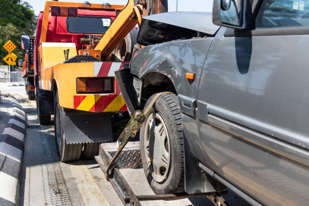 istock Tow truck towing a broken down car in emergency 1144153847