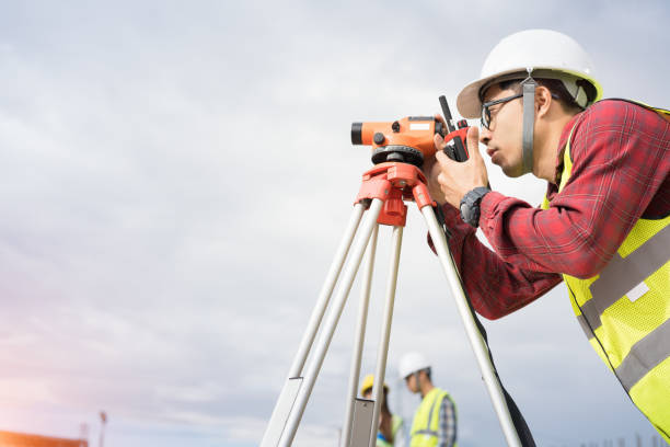 istock Engineer surveyor working with theodolite at construction site 1144155315