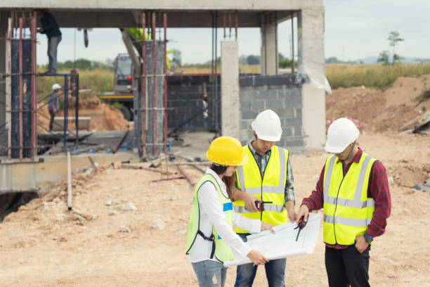 istock Architect and engineer meeting planning for a new project with construction equipment 1144155321