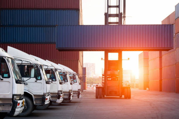 istock Industrial Container yard with forklift working in the morning for logistic import export background 1144156403