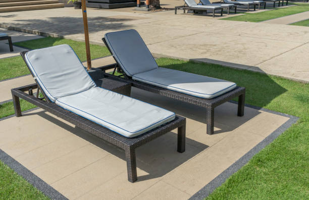 istock Daybeds in summer swimming pool. 1144156433