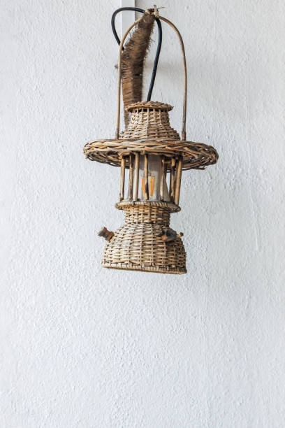 old oil lamp with white wall