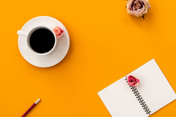 istock space orange vintage notebook with coffee and pencil 1144159746