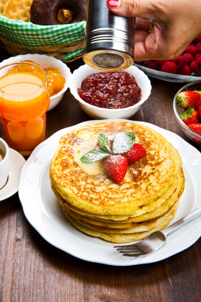 istock stack of freshly prepared traditional pancakes with strawberries 1144159888