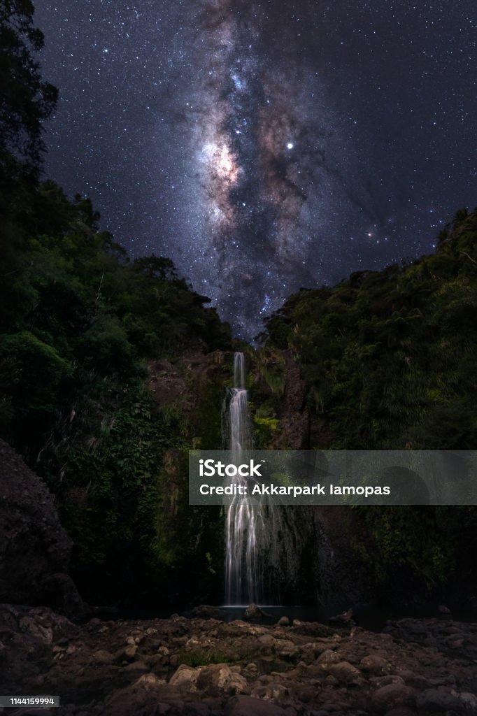 Milky Way at Kitekite Falls This is composite image. Kitekite Falls at Piha , Auckland  New Zealand New Zealand Stock Photo