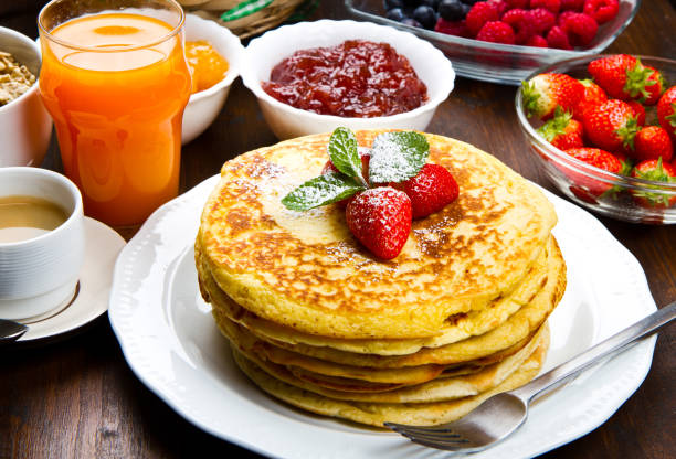 istock stack of freshly prepared traditional pancakes with strawberries 1144160650