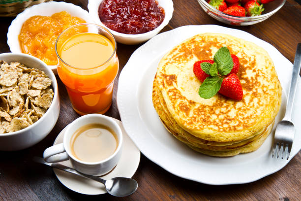 istock stack of freshly prepared traditional pancakes with strawberries 1144161523