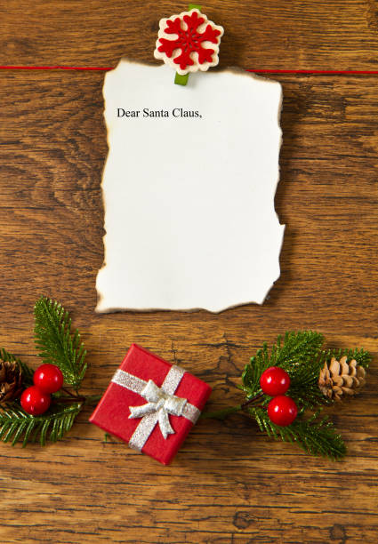istock blank note with christmas decoration on wooden background 1144162770