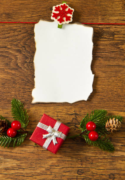 istock blank note with christmas decoration on wooden background 1144163067