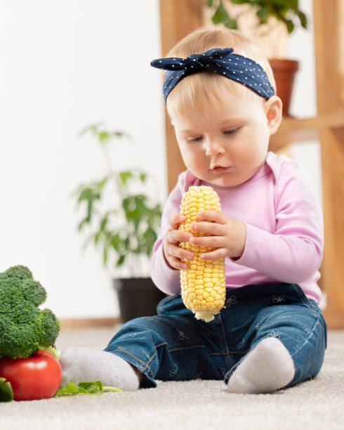 Small female child with corn