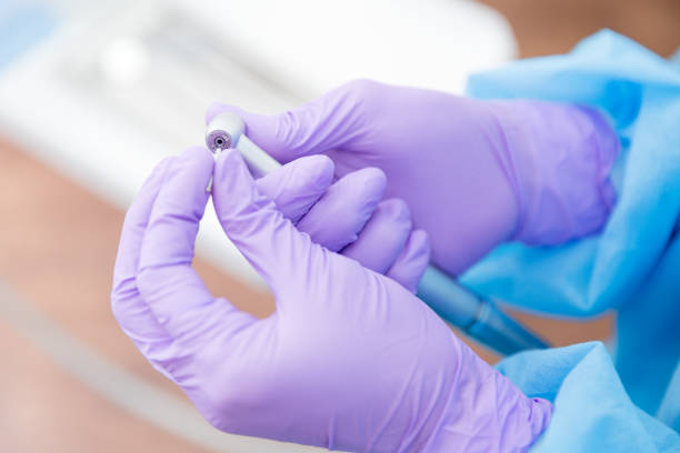 Dentist holding dental burs