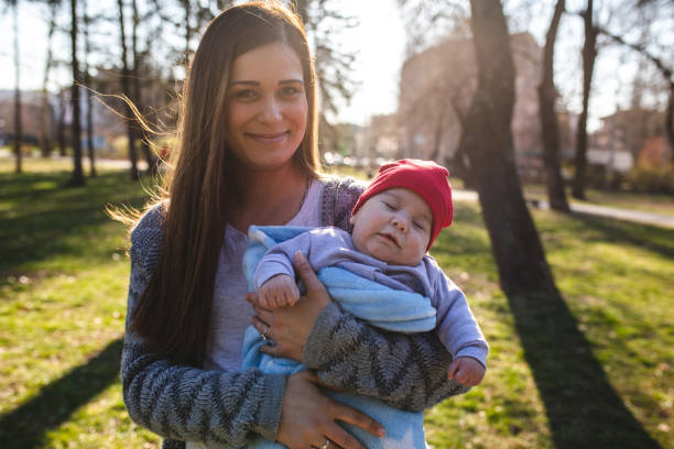 istock Cute little toddler resting in his mother's arms 1144166350