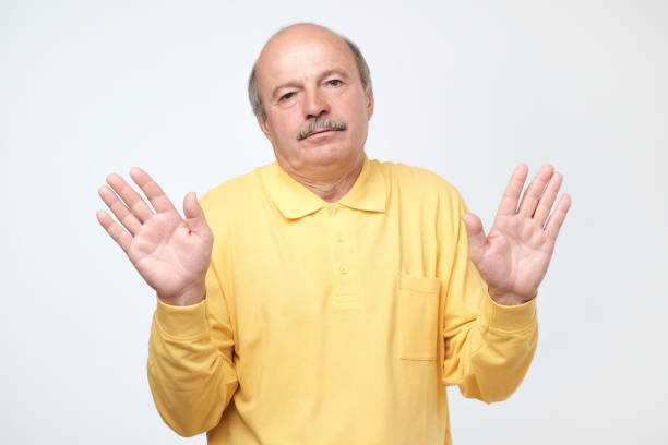 istock Handsome mature worker or fathert asking who cares, so what or not my problem 1144168158