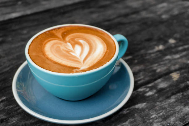 istock Coffee cup  on wooden table background. 1144169482