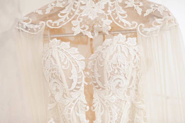 istock Elegant wedding dress on a hanger 1144169500