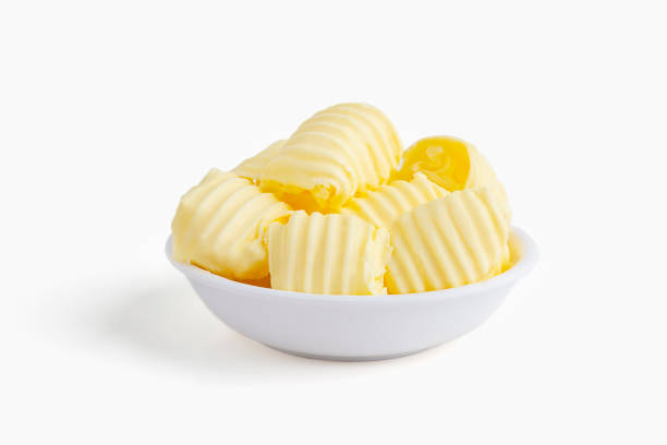 Fresh butter curl on white bowl with isolated background. Fresh butter curl on white bowl with isolated background. grain and cereal products stock pictures, royalty-free photos & images