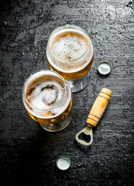 istock Glasses of beer and opener. 1144172348