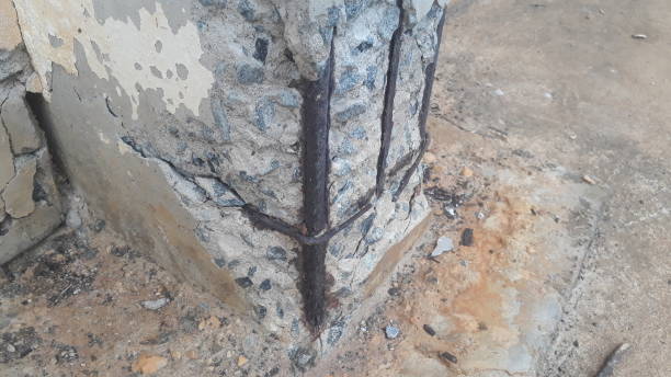 rusty steel showing on a broken reinforced concrete beam