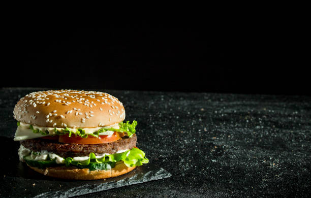istock Burger with juicy beef,tomatoes and salad. 1144175143